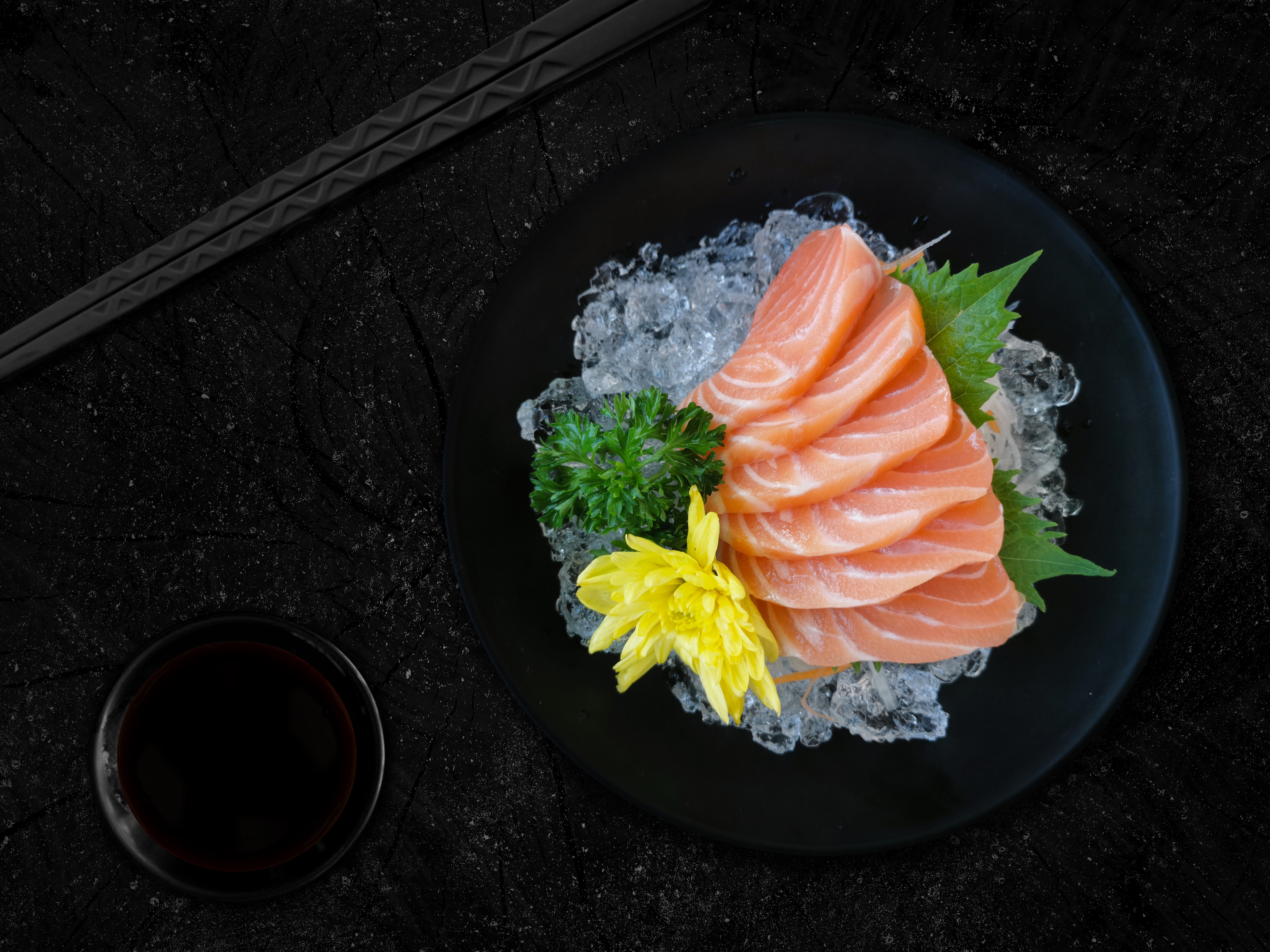 Sashimi salmon  black  bowl on  wood  background